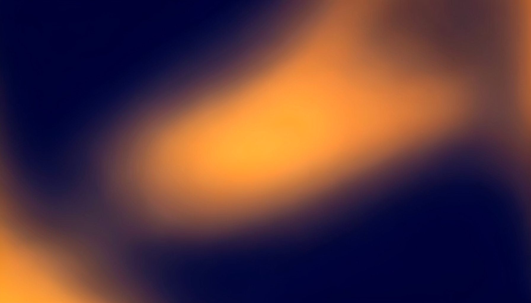 Deep navy gradient fading into warm amber at the edges, with a soft atmospheric glow across the center