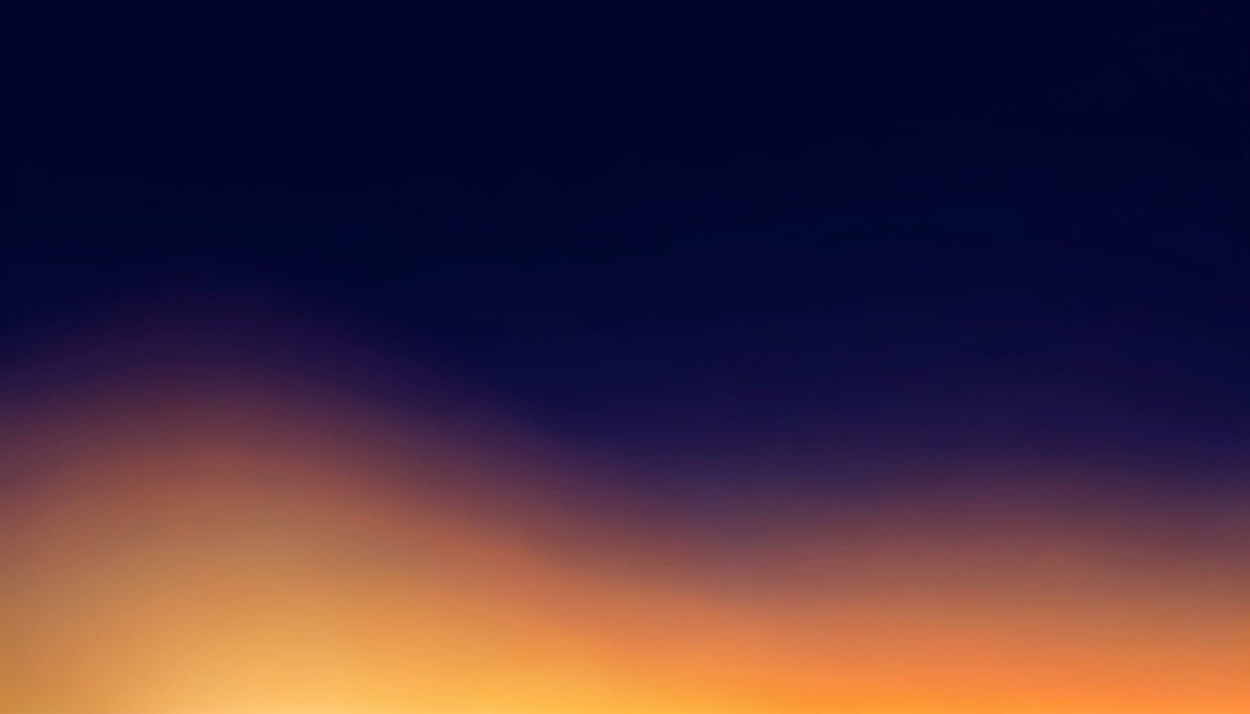 A deep navy-to-indigo gradient with soft warm amber light bleeding upward from the lower edge, creating a moody, inviting reading atmosphere